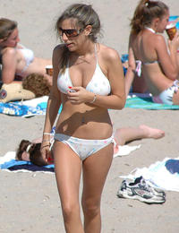 A busty bikini lady undressing on the Cancun Image 1